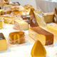 Table with various wrapped cheeses